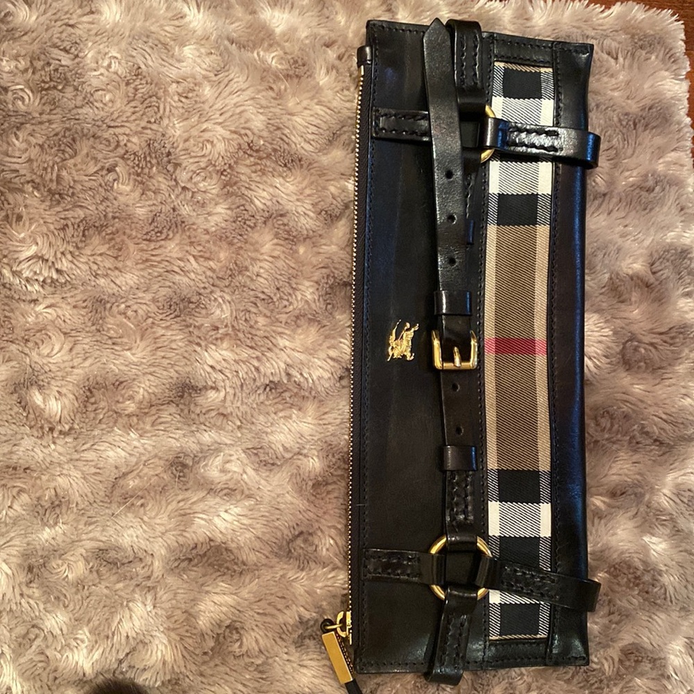 Burberry black leather clutch, elegant and classic.